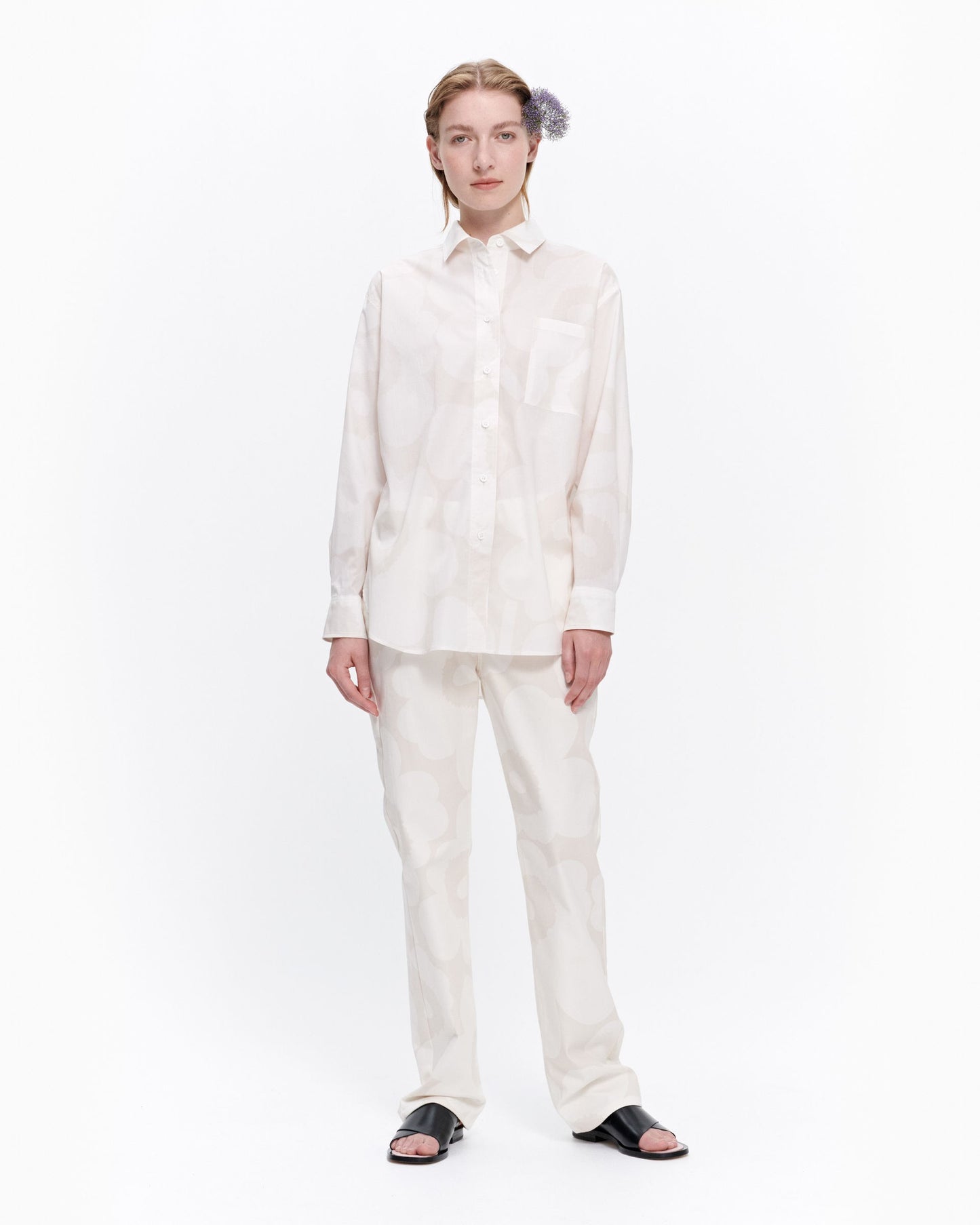Marimekko Kasvio button-up shirt is made of a light, thin cotton in the beige and off white Unikko (poppy) pattern