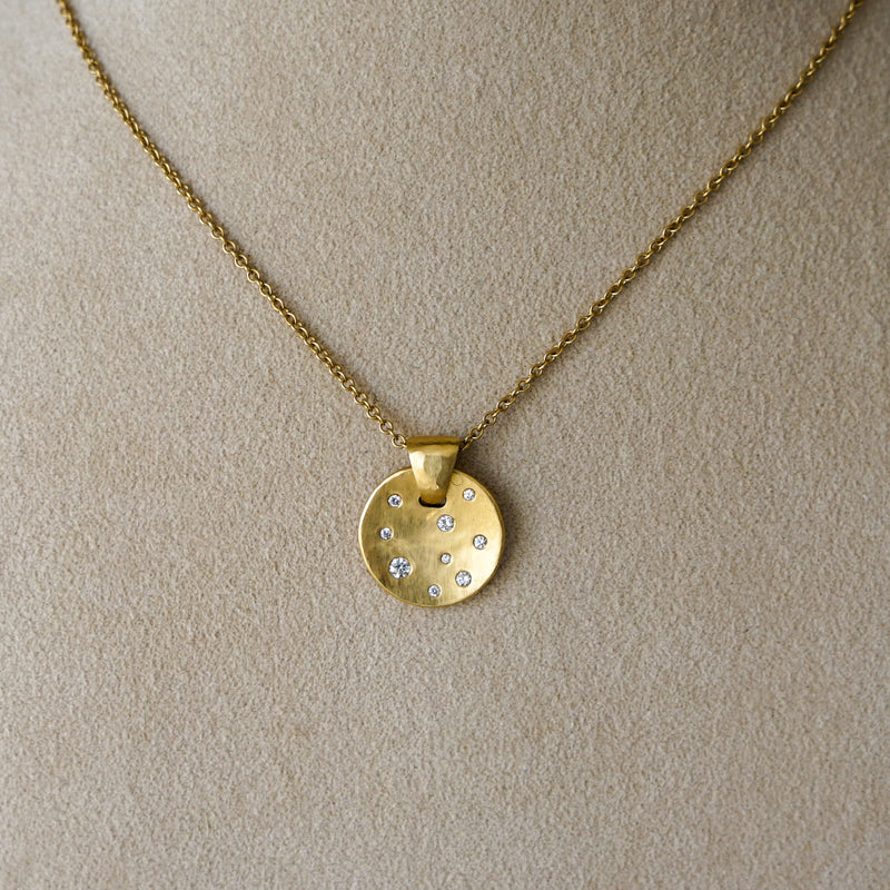 Concave 18 kt Gold Disk Pendant with Diamonds
