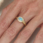 Oval Black Opal Ring with Diamonds in 18 kt Gold